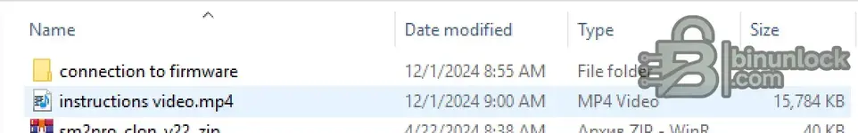 A folder containing an instructional video (instructions video.mp4) and firmware connection files for the Scanmatik 2 diagnostic tool.