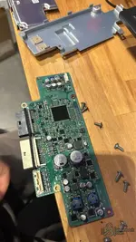 Internal circuit board of the BMW SME module showing the TC27X microcontroller prepared for crash data reset on the bench.